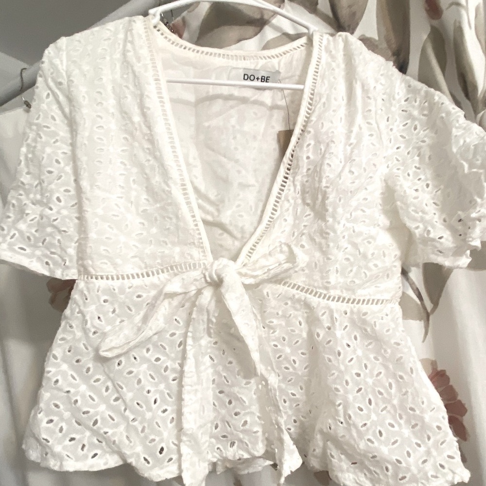 White open shirt with ability to tie.